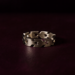 Silver ring on a dark background